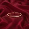 Change_bracelet_to_gold_red_202607151500_result-1.webp