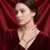 Change_bracelet_to_gold_red_202607161059_result-1.webp